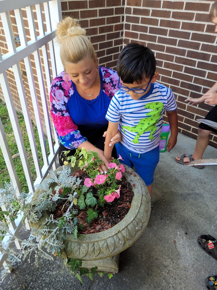 Students planting flowers and vegetables.